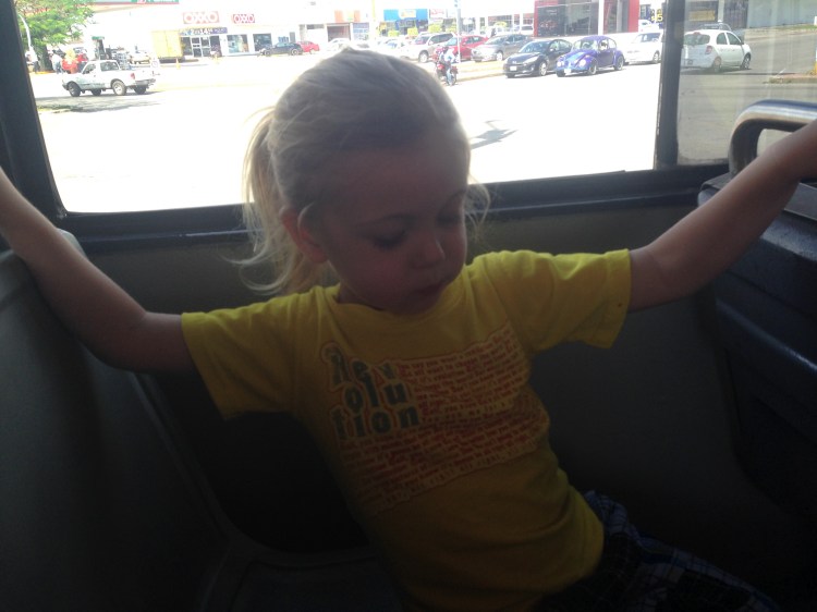 Instructing me on how I need to hold on while riding the bus.