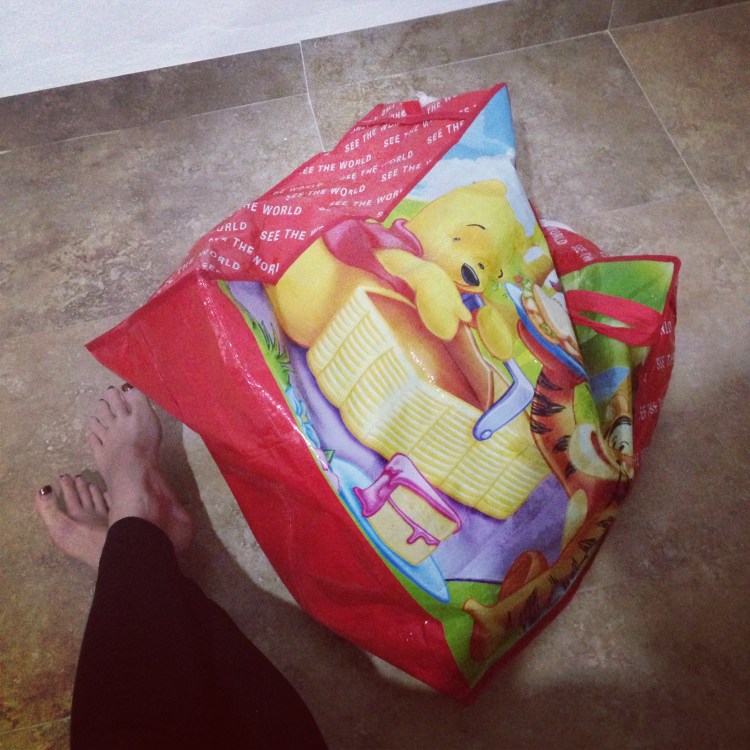 Baby in a (breathable) bag. Why haven't we played this before...?