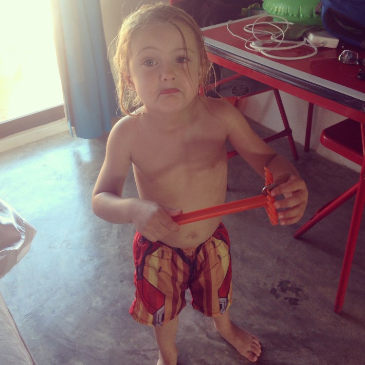 He lost his shovel to the sea. But then he found 5 pesos in the sand, so this frown didn't last too long